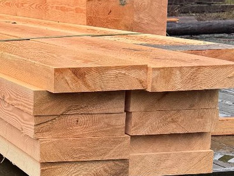Fresh cut timber beams in the yard