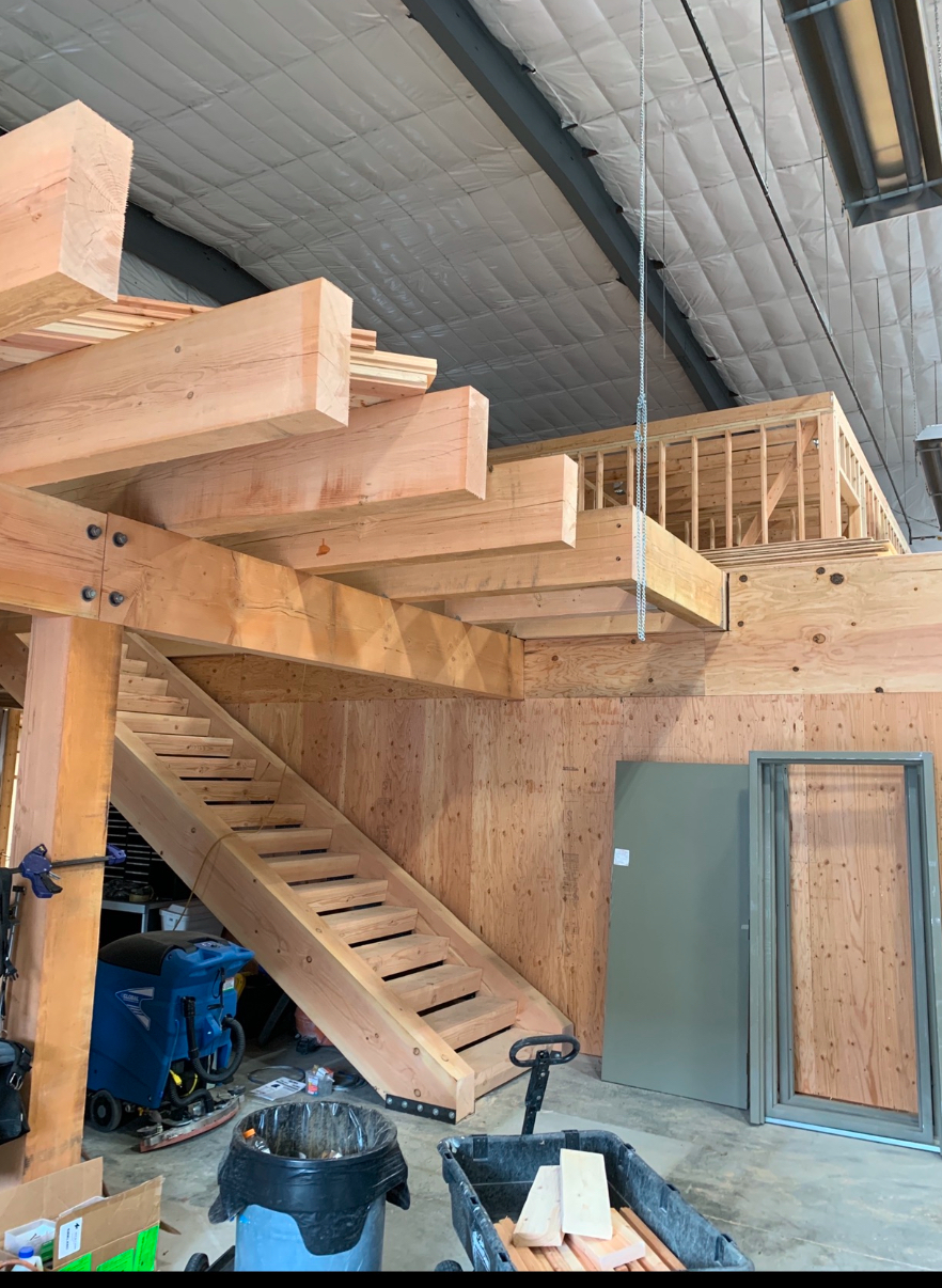 Heavy timber staircase and loft interior built with Douglas Fir
